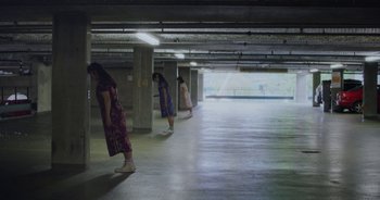 Movie still from “Amanda Sum - Groupthink” (2020), directed by Mayumi Yoshida – Extreme Wide shot, Low angle