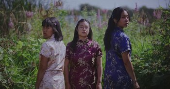 Movie still from “Amanda Sum - Groupthink” (2020), directed by Mayumi Yoshida – Medium shot, Low angle