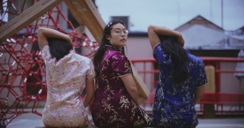 Movie still from “Amanda Sum - Groupthink” (2020), directed by Mayumi Yoshida – Medium shot, Low angle