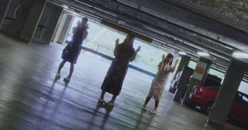 Movie still from “Amanda Sum - Groupthink” (2020), directed by Mayumi Yoshida – Wide shot, High angle