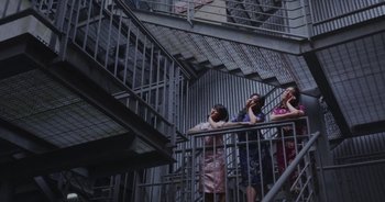 Movie still from “Amanda Sum - Groupthink” (2020), directed by Mayumi Yoshida – Wide shot, Low angle