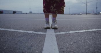 Movie still from “Amanda Sum - Groupthink” (2020), directed by Mayumi Yoshida – Wide shot, Low angle