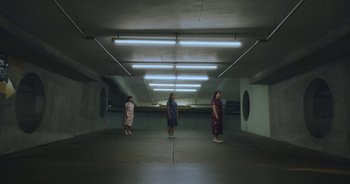 Movie still from “Amanda Sum - Groupthink” (2020), directed by Mayumi Yoshida – Extreme Wide shot, Low angle