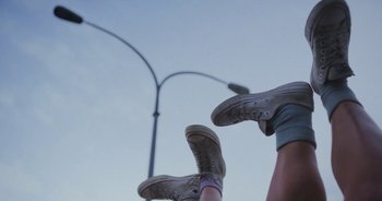 Movie still from “Amanda Sum - Groupthink” (2020), directed by Mayumi Yoshida – Wide shot, Low angle