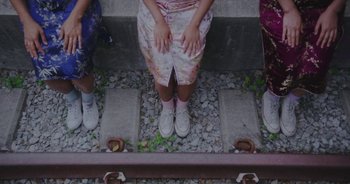 Movie still from “Amanda Sum - Groupthink” (2020), directed by Mayumi Yoshida – Medium shot, Overhead angle