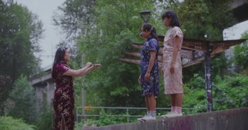 Movie still from “Amanda Sum - Groupthink” (2020), directed by Mayumi Yoshida – Wide shot, Low angle