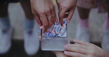 Movie still from “Amanda Sum - Groupthink” (2020), directed by Mayumi Yoshida – Extreme Close Up shot, Overhead angle