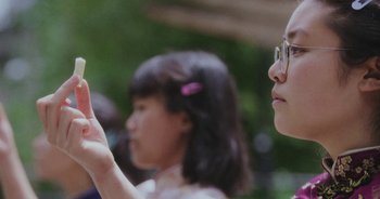 Movie still from “Amanda Sum - Groupthink” (2020), directed by Mayumi Yoshida – Extreme Close Up shot, Low angle