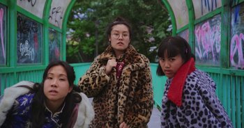 Movie still from “Amanda Sum - Groupthink” (2020), directed by Mayumi Yoshida – Medium shot, Low angle