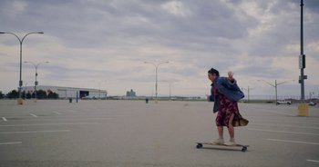 Movie still from “Amanda Sum - Groupthink” (2020), directed by Mayumi Yoshida – Wide shot, Low angle