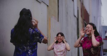 Movie still from “Amanda Sum - Groupthink” (2020), directed by Mayumi Yoshida – Medium shot, Low angle