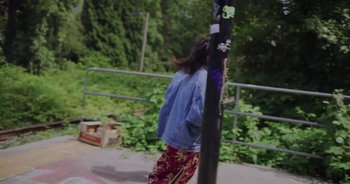 Movie still from “Amanda Sum - Groupthink” (2020), directed by Mayumi Yoshida – Wide shot, Low angle