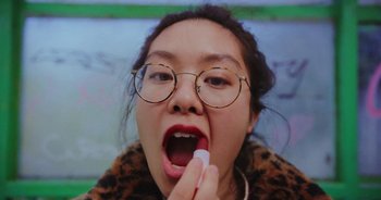 Movie still from “Amanda Sum - Groupthink” (2020), directed by Mayumi Yoshida – Extreme Close Up shot, Low angle