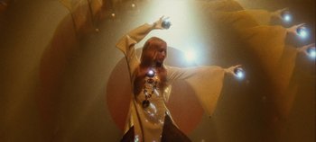 Movie still from “Agnes - Fingers Crossed” (2020), directed by SWIM CLUB – Medium shot, Low angle