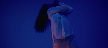 Movie still from “Agnes - Fingers Crossed” (2020), directed by SWIM CLUB – Medium shot, Low angle