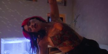 Movie still from “Dua Lipa - Levitating feat. Madonna & Missy Elliott” (2020), directed by Will Hooper – Medium shot, Low angle