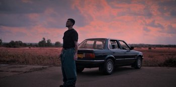 Movie still from “Dua Lipa - Levitating feat. Madonna & Missy Elliott” (2020), directed by Will Hooper – Wide shot, Low angle