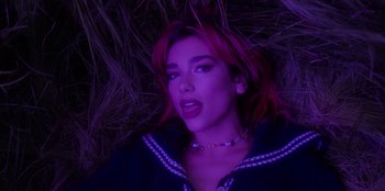 Movie still from “Dua Lipa - Levitating feat. Madonna & Missy Elliott” (2020), directed by Will Hooper – Close Up shot, Overhead angle