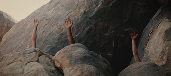 Movie still from “AMAARA - Desert Storm” (2020), directed by Kaelen Ohm – Medium shot, Overhead angle