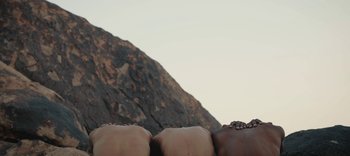 Movie still from “AMAARA - Desert Storm” (2020), directed by Kaelen Ohm – Medium shot, Overhead angle