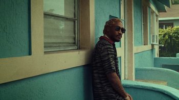 Movie still from “SAINt JHN - Roses (Remix) feat. Future” (2020), directed by John Tashiro – Medium shot, Low angle