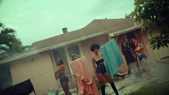 Movie still from “SAINt JHN - Roses (Remix) feat. Future” (2020), directed by John Tashiro – Wide shot, Low angle