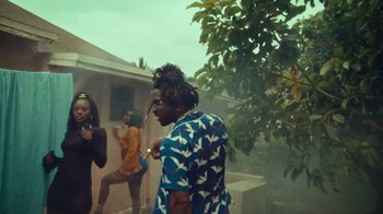 Movie still from “SAINt JHN - Roses (Remix) feat. Future” (2020), directed by John Tashiro – Medium shot, Low angle