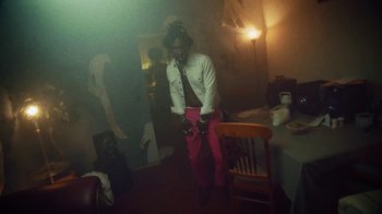 Movie still from “SAINt JHN - Roses (Remix) feat. Future” (2020), directed by John Tashiro – Medium shot, Low angle