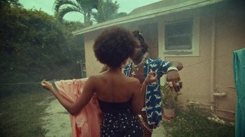 Movie still from “SAINt JHN - Roses (Remix) feat. Future” (2020), directed by John Tashiro – Medium shot, Over the shoulder angle