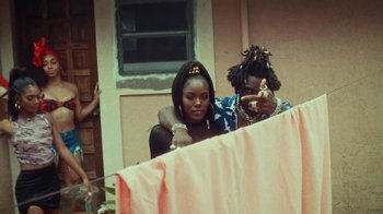 Movie still from “SAINt JHN - Roses (Remix) feat. Future” (2020), directed by John Tashiro – Medium shot, Over the shoulder angle