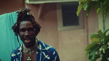 Movie still from “SAINt JHN - Roses (Remix) feat. Future” (2020), directed by John Tashiro – Close Up shot, Low angle