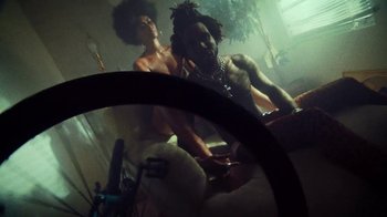 Movie still from “SAINt JHN - Roses (Remix) feat. Future” (2020), directed by John Tashiro – Medium shot, Low angle