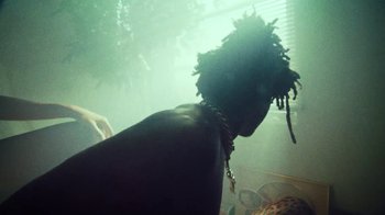 Movie still from “SAINt JHN - Roses (Remix) feat. Future” (2020), directed by John Tashiro – Medium shot, Low angle
