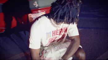 Movie still from “SAINt JHN - Roses (Remix) feat. Future” (2020), directed by John Tashiro – Medium shot, Low angle