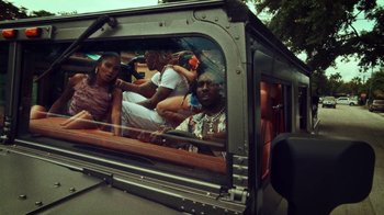 Movie still from “SAINt JHN - Roses (Remix) feat. Future” (2020), directed by John Tashiro – Medium shot, Low angle