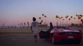 Movie still from “SAINt JHN - Roses (Remix) feat. Future” (2020), directed by John Tashiro – Medium shot, Low angle