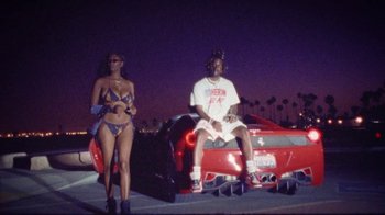 Movie still from “SAINt JHN - Roses (Remix) feat. Future” (2020), directed by John Tashiro – Wide shot, Low angle