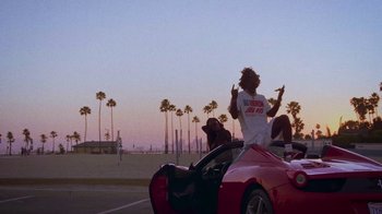 Movie still from “SAINt JHN - Roses (Remix) feat. Future” (2020), directed by John Tashiro – Medium shot, Low angle