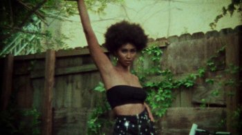 Movie still from “SAINt JHN - Roses (Remix) feat. Future” (2020), directed by John Tashiro – Medium shot, Low angle