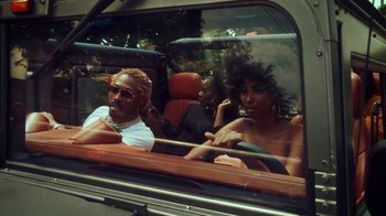 Movie still from “SAINt JHN - Roses (Remix) feat. Future” (2020), directed by John Tashiro – Medium shot, Low angle