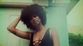 Movie still from “SAINt JHN - Roses (Remix) feat. Future” (2020), directed by John Tashiro – Medium shot, Low angle