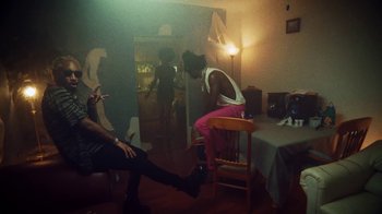 Movie still from “SAINt JHN - Roses (Remix) feat. Future” (2020), directed by John Tashiro – Wide shot, Over the shoulder angle