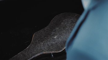 Movie still from “Dent May - I Could Use A Miracle” (2020), directed by Nathan Castiel – Extreme Close Up shot, Overhead angle