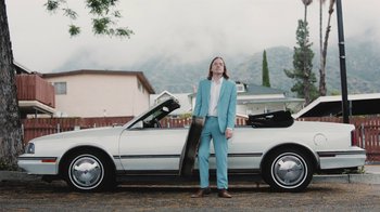 Movie still from “Dent May - I Could Use A Miracle” (2020), directed by Nathan Castiel – Medium shot, Low angle