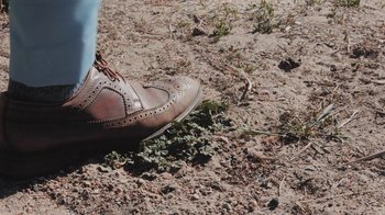 Movie still from “Dent May - I Could Use A Miracle” (2020), directed by Nathan Castiel – Extreme Close Up shot, Low angle