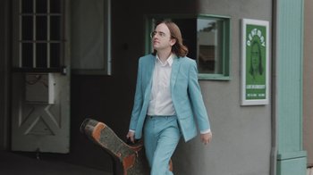 Movie still from “Dent May - I Could Use A Miracle” (2020), directed by Nathan Castiel – Medium shot, Low angle
