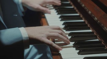 Movie still from “Dent May - I Could Use A Miracle” (2020), directed by Nathan Castiel – Extreme Close Up shot, Overhead angle