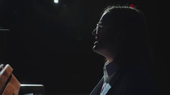 Movie still from “Dent May - I Could Use A Miracle” (2020), directed by Nathan Castiel – Close Up shot, Low angle