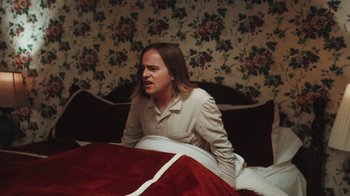 Movie still from “Dent May - I Could Use A Miracle” (2020), directed by Nathan Castiel – Medium shot, Low angle
