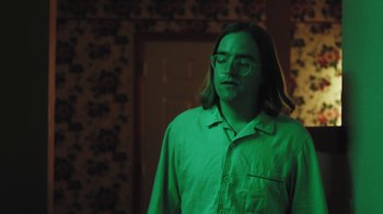 Movie still from “Dent May - I Could Use A Miracle” (2020), directed by Nathan Castiel – Medium shot, Low angle